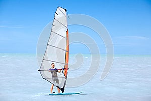 Young man on a windsurf