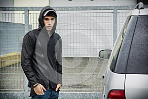 Young man in a winter anorak with hood photo