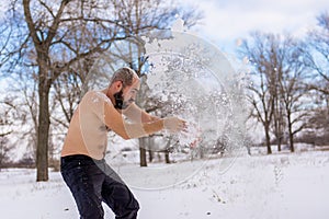 Young Man wiping snow in the winter, to promote health.