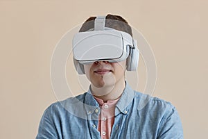 Young man in wireless VR glasses