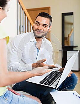 Young man and woman with business papers