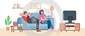 Young man and woman couple sitting on sofa and watching TV.