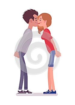 Young man and woman exchanging kisses