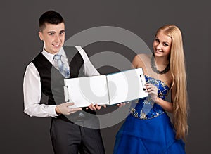 Young man and woman holding clip boards