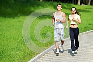 Young man and woman jogging