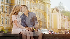 Young man and woman kissing on sweet romantic date, happiness and love, couple