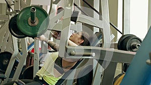 Young man and woman relaxing and exercising at the gym.