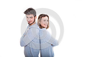Young man and woman are standing back each other, isolated on white