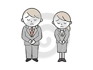 A young man and woman in suits bow and apologize with troubled expressions