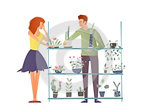 Young man and woman takes care of houseplants. Caring for indoor plants, hobby. A florist and a customer in a flower
