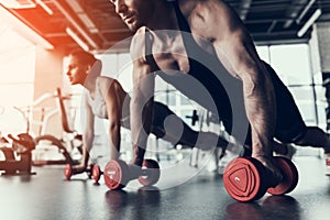 Young Man and Woman Training in Fitness Club.