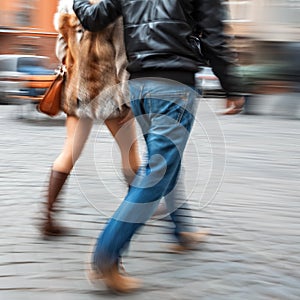 Young man and woman walking down the street