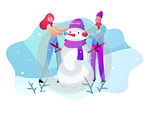 Young Man and Woman in Warm Clothing Making Snowman on Snowy Landscape Background. Winter Time Outdoor Holidays Activity
