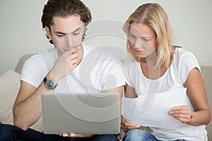 Young man and woman working with laptop