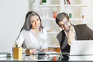 Young man and woman working on project