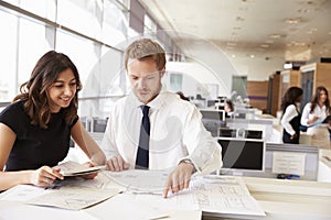 Young man and woman working together in architect?s office