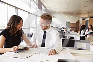 Young man and woman working together in architect?s office