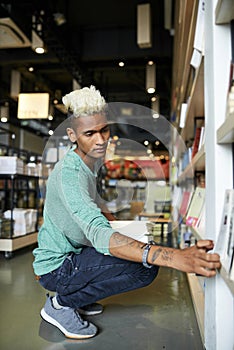 Young man working in bookstore