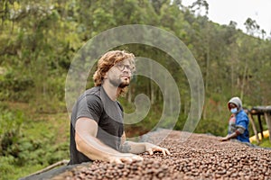 Young man working at coffee farm, anaerobic treatment