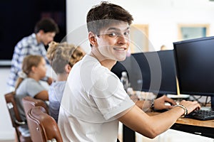 Young man working on computer in IT training room