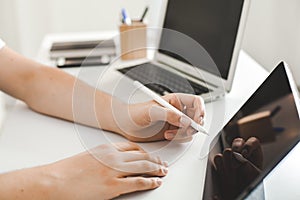 YOUNG MAN WORKING ON DESK AT HOME OFFICE BUSINESS