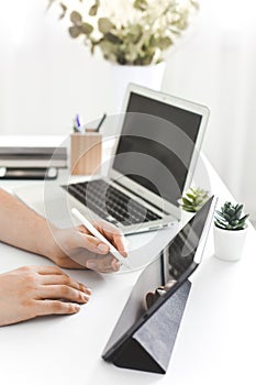 YOUNG MAN WORKING ON DESK AT HOME OFFICE BUSINESS photo