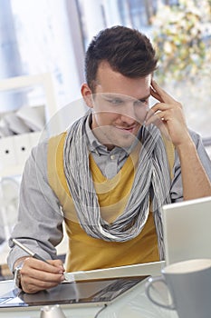 Young man working with drawing pad