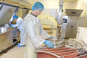 Young man working on food processing factory photo