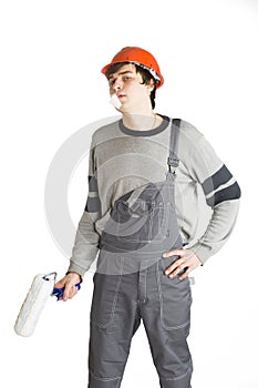 A young man in working grey clothes and orange hard helmet man with tape over mouth. Isolated on white background.