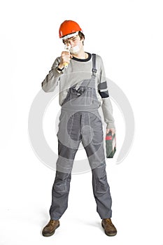 A young man in working grey clothes and orange hard helmet man with tape over mouth. Isolated on white background.