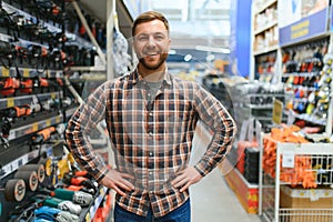 Young man working in hardware store