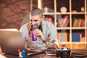 Young man working on his laptop computer