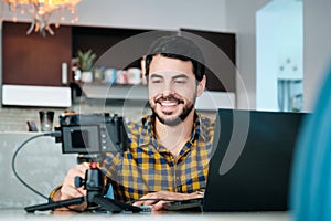 Young Man Working From Home Making Business Web Conference