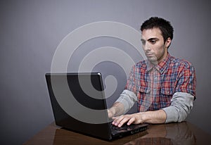 Young man working on laptop