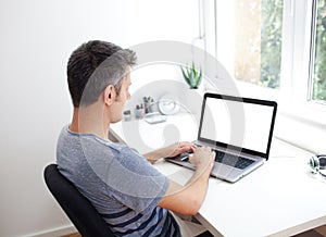 Young man working on laptop