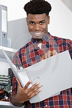 Young man working olders in office