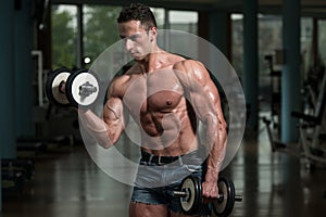 Young Man Working Out Biceps