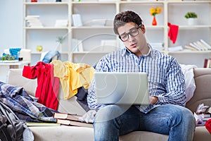 The young man working studying in messy room