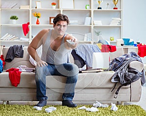 Young man working studying in messy room