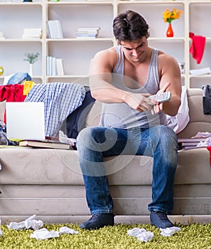 Young man working studying in messy room