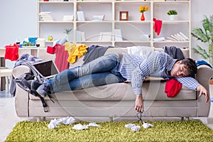 The young man working studying in messy room