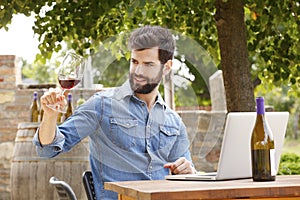 Young man working in a vineyard