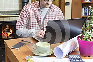 Young man works remotely through internet connection