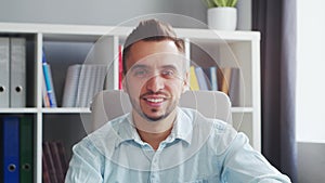 Young Man Works while Sitting in front of a Computer at Home. The Workplace of a Professional Worker, Freelancer or