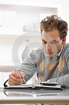 Young man writing