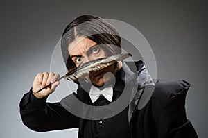 The young man with writing feather