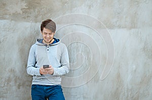 Young man writing sms