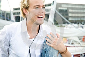 Young man at a yachtclub