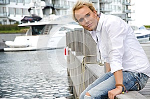 Young man at a yachtclub