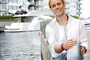 Young man at a yachtclub
